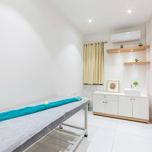 Spa relaxation area interior with cozy seating in Coimbatore wellness centre